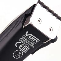 A set of two VGR V-023 2-in-1 rechargeable hair and beard clippers, a wired trimmer with a set of removable attachments in the V023 bag